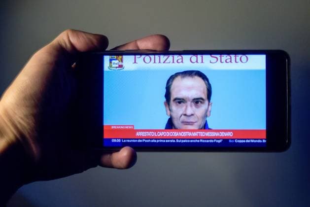 January 16, 2023, Italy: In this photo illustration, a smartphone screen with live news from an Italian television channel about the arrest of fugitive Matteo Messina Denaro. Matteo Messina Denaro considered the head of the Cosa Nostra mafia organization, had been on the run for thirty years and was Italy s number one wanted man. Italy - ZUMAs197 20230116_zaa_s197_049 Copyright: xVincenzoxNuzzolesex