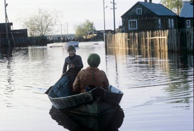 Flood in Syktyvkar 8355992 08.05.1987 Komi Republic. Hundreds of rivers and rivulets flow on the territory of the region, which flood the oldest district of Syktyvkar, Zarechye. The streets here are called none other than Navigable, Splavnaya, Vodnaya. Residents of the flooded area travel by boat. Mikhail Dmitiev Syktyvkar Republic of Komi Russia  Copyright: xMikhailxDmitievx