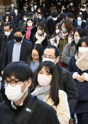 Scene of Tokyo People wearing face masks walk in front of JR Tokyo Station in the Japanese capital during the morning commuting hours of Jan. 20, 2023, amid the spread of coronavirus infections.  A14AA0001386454P