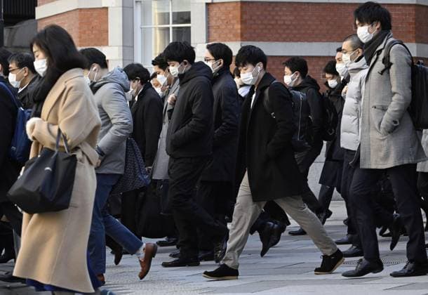 Scene of Tokyo People wearing face masks walk in front of JR Tokyo Station in the Japanese capital during the morning commuting hours of Jan. 20, 2023, amid the spread of coronavirus infections.  A14AA0001386455P