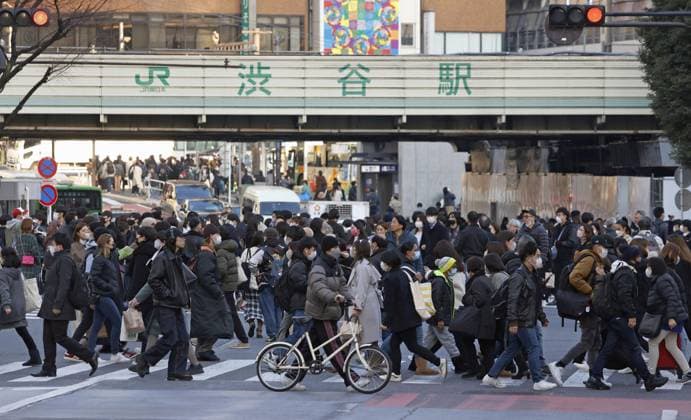 Tokyo scene amid coronavirus pandemic People wear face masks outdoors near Tokyo s Shibuya station on Jan. 20, 2023. Japanese Prime Minister Fumio Kishida announced same day plans to downgrade the legal status of COVID-19 to the equivalent of seasonal influenza in the spring.  A14AA0001386700P