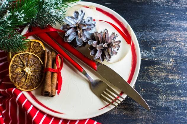 RECORD DATE NOT STATED Christmas table setting with bright napkin, spices, decorations and vintage silverware on rustic wooden table , 38366580.jpg, branch, celebration, christmas, copyspace, december, decor, decoration, dinner, eve, fir, food, fork, holiday, life, merry, napkin, new, object, orange, ornament, party, pine, plate, romantic, rustic, season, seasonal, served, set, setting, spices, still, table, traditional, vintage, winter, wooden, xmas, year