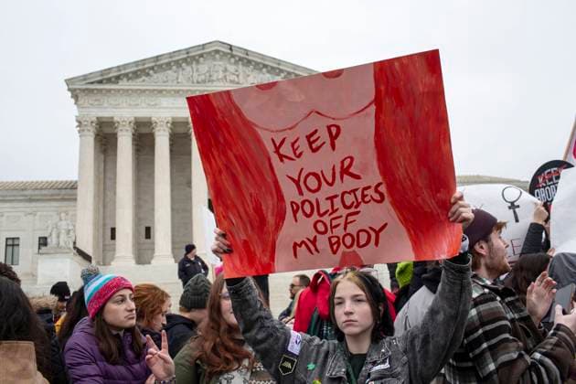 January 22, 2023, Washington, District of Columbia, United State: An abortion-rights activist holding a sign near the Supreme Court building while taking part in the annual National Women s March in Washington DC, marking the 50th anniversary of the 1973 US Supreme Court Roe v. Wade decision. The Court on June 24, 2022, struck down the Roe v. Wade decision which legalized abortion, ending five decades of constitutional protections. Washington United State - ZUMAr125 20230122_zap_r125_007 Copyright: xProbalxRashidx