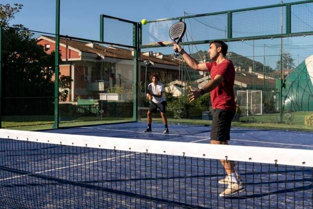 Men playing paddle tennis at sports court model released, Symbolfoto property released, FMOF01616
