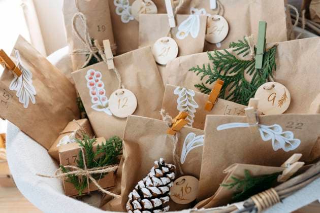 Decorated brown bags with gift boxes and pine cones kept in basket model released, Symbolfoto property released, SSYF00056