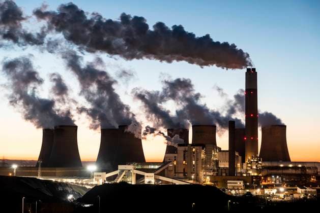 UK, England, Nottingham, Water vapor rising from cooling towers of coal-fired power station at dusk, WPEF06857