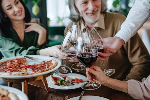 Happy family making toast together sitting at dining table in cafe model released, Symbolfoto property released, YTF00503