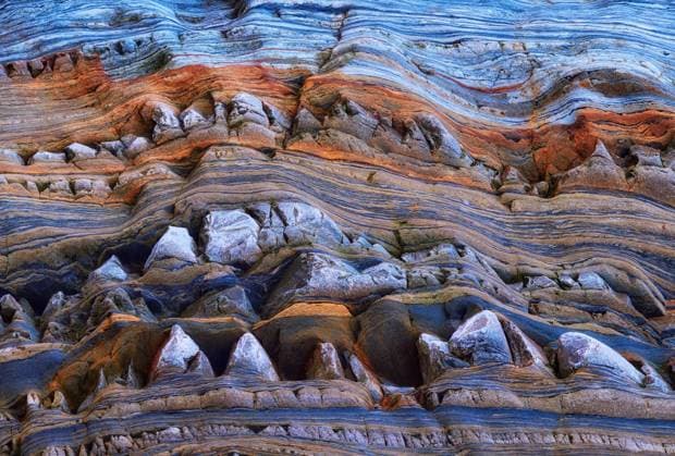 Creative Highlights World Textured background of uneven surface of brown and blue surface of rough rocky formation in Asturias CesarLlaneza_ID12414_377817_016 Copyright: xCesarxLlanezax Model Released