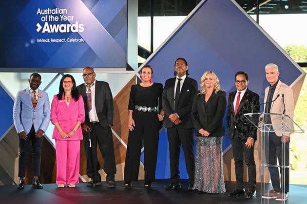 2023 AUSTRALIAN OF THE YEAR AWARDS, (L-R) Tasmania?s Australian of the year John Kamara, West Australia?s Australian of the year Prof. Samar Aoun, Northern Territory?s Australian of the year Samuel Bush-Blanasi, Australian Capital Territory?s Australian of the year Olympia Yarger, Queensland Australian of the year William Barton, South Australia?s Australian of the year Taryn Brumfitt, Victoria?s Australian of the year Dr Angraj Khillan and New South Wales?s Australian of the year Craig Foster pose for a photograph before the 2023 Australian of the Year Awards ceremony at the National Arboretum in Canberra, Wednesday, January 25, 2023. ( NO ARCHIVING, EDITORIAL USE ONLY, NO USE IN BOOKS WITHOUT CONSENT CANBERRA AC Copyright: xMICKxTSIKASx 20230125001756401446