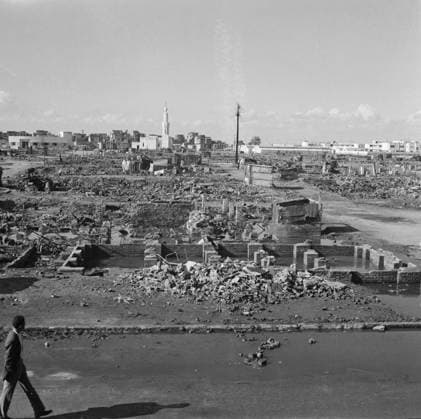 Port Said, Egypt. December 19, 1956. A city resident walks in the Al-Manakh quarter destroyed by the British and French forces during the Suez Crisis. Pyotr Yegorov TASS  13774589