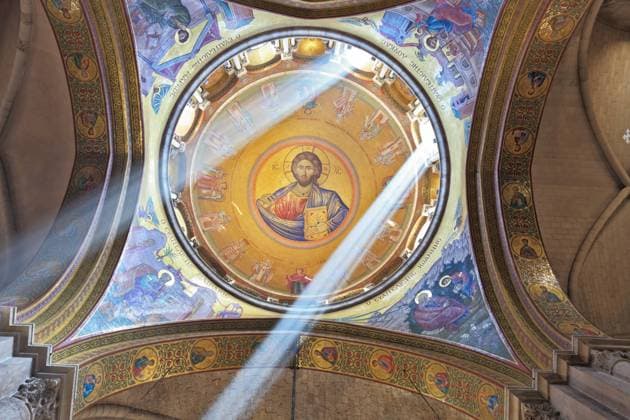 On a ceiling image of the Christ Savior Facilities in the Holy Sepulchre. The magnificent round arch of a ceiling is shined with two bright beams of the sun. On a ceiling image of the Christ Savior Copyright: xZoonar.com kavramx 6197963