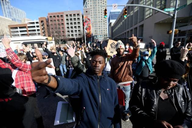 January 28, 2023, Raleigh, North Carolina, USA: Protesters raise their middle fingers towards a line of Wake County SheriffÃ¢â‚¬â ¢s officers as they marched through downtown Raleigh during a march in solidarity against police brutality in memory of RaleighÃ¢â‚¬â ¢s own Darryl Williams and Tyre Nichols of Memphis. The protest comes in the aftermath of Memphis police releasing body camera videos showing the violent arrest that ended with Tyre NicholsÃ¢â‚¬â ¢ death. Raleigh USA - ZUMAk251 20230128_znp_k251_018 Copyright: xBobxKarpx