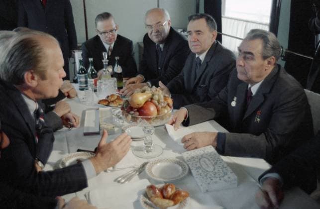 Primorye Region, USSR. President of the United States of America Gerald Rudolph Ford Jr. (L), General Secretary of the Central Committee of the CPSU (KPSS) Leonid Brezhnev, Minister of Foreign Affairs of the USSR Andrei Gromyko, Ambassador Extraordinary and Plenipotentiary of the USSR to the United States of America Anatoly Dobrynin and assistant for foreign affairs to the General Secretary of the Central Committee of the CPSU (KPSS) L. Brezhnev Andrei Aleksandrov, (R-L) hold talks in a railway carriage on their way to the Okeansky military sanatorium. G. Ford arrived in the USSR after his official visits to Japan and the Republic of Korea for talks with L. Brezhnev on the strategic arms limitation and the preparation of an appropriate tre  31930708
