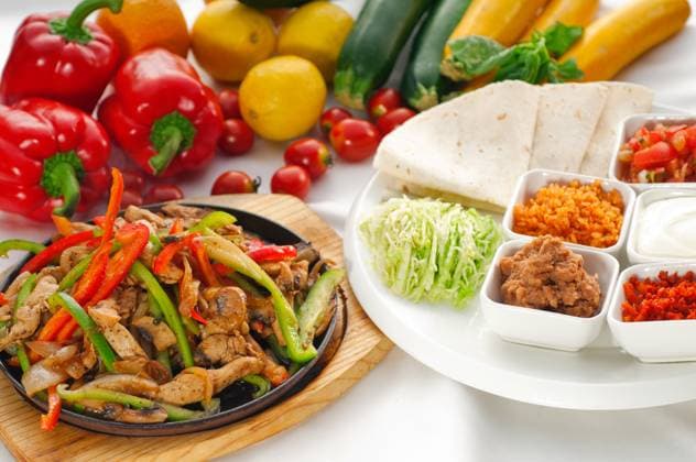 IMAGO Creative, Food, Fajita RECORD DATE NOT STATED original fajita sizzling smoking hot served on iron plate and fresh vegetables on background ,MORE DELICIOUS FOOD ON PORTFOLIO , 41628544.jpg, appetizing, authentic, barbeque, beef, chicken, chili, closeup, colorful, cuisine, delicious, dinner, dish, fajita, fajitas, food, fresh, fry, gourmet, green, grilled, guacamole, healthy, hot, iron, lunch, macro, meal, meat, mexican, mexico, onion, pan, pepper, plate, platter, red, restaurant, salsa, sauce, serve, snack, spicy, tomato, tortilla, traditional, vegetables, sizzling