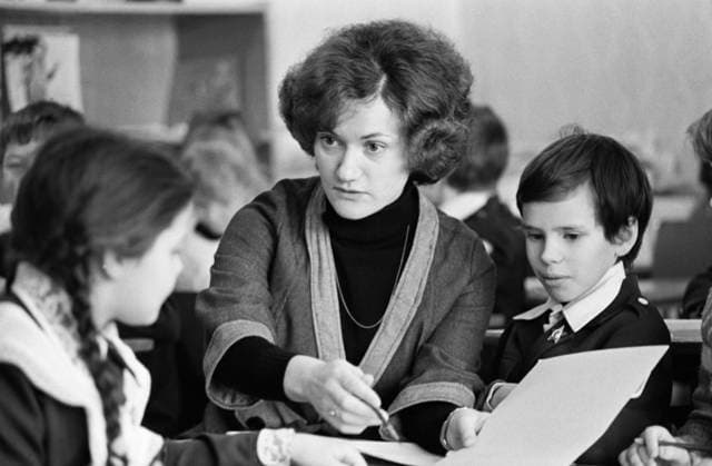 Khabarovsk Region, USSR. Teacher of secondary school T. Ostrovskaya, who came to the BAM on Komsomol voucher from Donetsk, holds a class for third year students at Railway Secondary School No. 91 in Novy Urgal Village of Verkhnebureinsky District on the eastern section of the Baikal-Amur Mainline. Sergei Metelitsa TASS  15642606