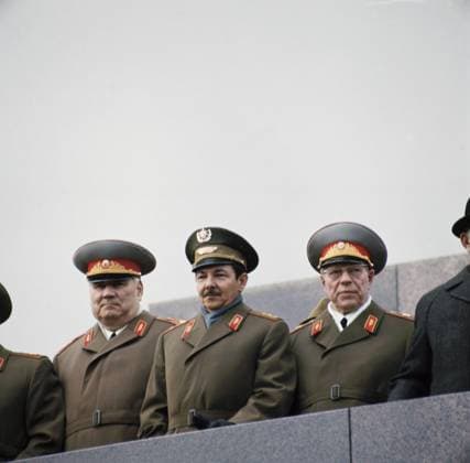 Moscow, USSR. First Deputy Minister of Defence of the USSR Ivan Yakubovsky, Second Secretary of the Communist Party of Cuba, Minister of the Cuban Revolutionary Armed Forces Raul Modesto Castro Ruz and Minister of Defence of the USSR Dmitry Ustinov (L-R) on the Lenin Mausoleum greet participants of the International Workers Day demonstration go through Red Square. Vladimir Musaelyan TASS  18579047