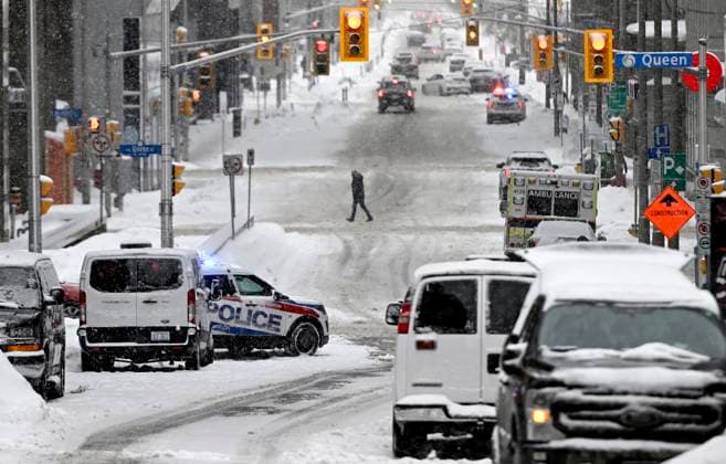 January 29, 2023, Ottawa, ON, CAN: Police and emergency vehicles stand by on Queen Street south of Parliament Hill on the one year anniversary of the Freedom Convoy on Parliament Hill in Ottawa, on Sunday, Jan. 29, 2023. Ottawa CAN  - ZUMAc35_ 20230129_zaf_c35_009 Copyright: xJustinxTangx