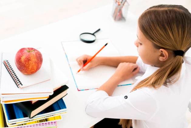 cute girl uniform studying desk cute girl uniform studying desk Copyright: xZoonar.com OleksandrxLatkunx 18584240 ,model released, Symbolfoto ,property released