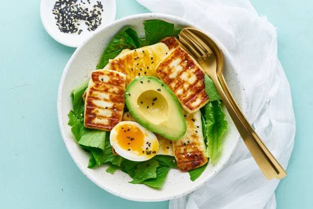 keto ketogenic diet soft boiled eggs with avocado and lettuce on pastel background closeup top view keto ketogenic diet soft boiled eggs with grilled haloumi, avocado and lettuce, mediterranean cuisine on pastel background Copyright: xZoonar.com NataliaxGdovskaiax 18619699