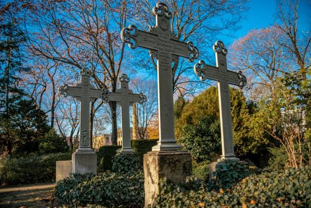 Old weathered crosses on a german graveyard in Berlin Old weathered crosses on a german graveyard in Berlin on a bright winter day Copyright: xZoonar.com InaxHenselx 14859025