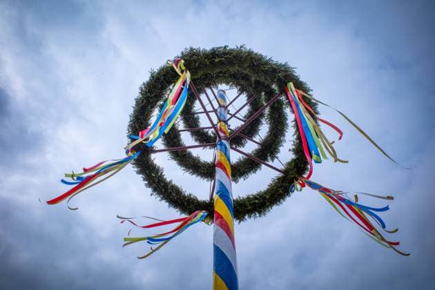 a maypole decorated with colorful ribbons