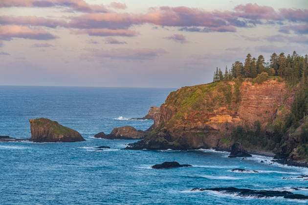 Creative Highlights World Sunset over the rugged coastline of Norfolk Island, Australia, Pacific Copyright: MichaelxRunkel 1184-7693
