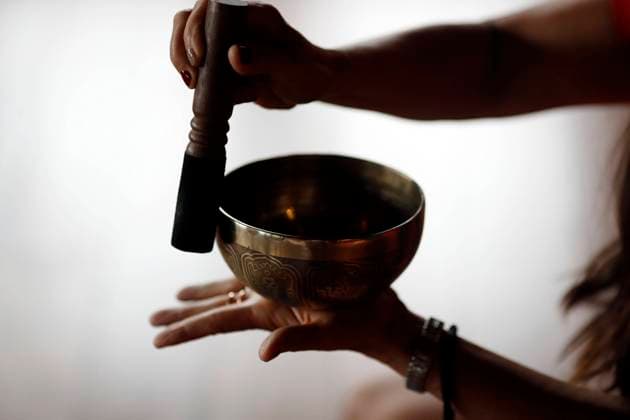 Bowl in the hands of prayer, Tibetan singing bowl, Buddhist instrument used in sound therapy, meditation and yoga, Quang Ninh, Vietnam, Indochina, Southeast Asia, Asia Copyright: Godong 809-8599