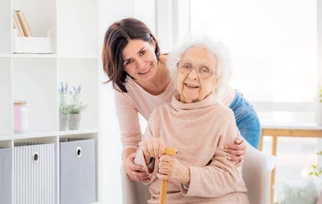 RECORD DATE NOT STATED Happy elderly woman embraced by daughter at home, model released, , 42523520.jpg, cane, adult, age, aged, beautiful, care, elder, elderly, female, generation, grandma, grandmother, grandparent, granny, indoors, love, lovely, mature, mom, mother, old, older, parent, parenting, pensive, senior, woman, happy, pensioner, respect, help, honor, relax, handle, support, tool, loneliness, stick, sit, calm, wise, cute, kind, family, daughter, nurse
