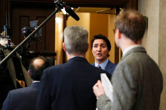 February 6, 2023, Ottawa, ON, Canada: Prime Minister Justin Trudeau talks to reporters in the foyer as he arrives for question period in the House of Commons on Parliament Hill in Ottawa on Monday, Feb. 6, 2023. Ottawa Canada  - ZUMAc35_ 20230206_zaf_c35_014 Copyright: xSeanxKilpatrickx