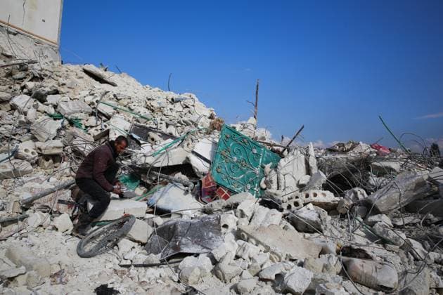 February 7, 2023, Atarib, Syria: Aleppo, Syria. 07 February 2023. Syrians try to salvage some belongings from the rubble in the city of Atarib, in the western Aleppo countryside, in the aftermath of a major earthquake in the region. On Tuesday afternoon the number of victims in Atarib has reached 150 dead and more than 200 injured. The damage to road and infrastructures has added further complexity to the rescue operations and the delivery of aid to many areas affected by the quake in northwest Syria Atarib Syria - ZUMAd99_ 20230207_zap_d99_059 Copyright: xJumaxMohammadx
