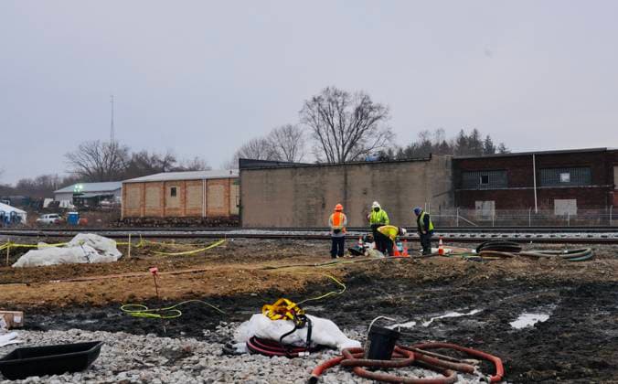 (230215) -- EAST PALESTINE (U.S.), Feb. 15, 2023 -- Workers drain contaminated water on the site of the Feb. 3 derailment on the outskirts of the village of East Palestine, Ohio, the United States, on Feb. 14, 2023. Residents in and around the village of East Palestine feared for their health and concerns have mounted about the environmental effect, after about 50 Norfolk Southern train cars, including 20 carrying hazardous materials, derailed on Feb. 3 on the outskirts of the village. (Photo by Xinhua) TO GO WITH Roundup: Ohio derailment leads to long-term environmental, health, legal concerns U.S.-OHIO-EAST PALESTINE-TRAIN-DERAILMENT PhilxZhang 