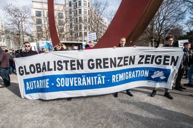 February 18, 2023, Munich, Bavaria, Germany: Identitaere Bewegung, Burschenschaften, Studenten Stehen Auf members hold a banner at an AfD demo. One of the people is Adrian who participated in a disturbance at the Nord Stream terminal. In collaboration with JoÂ¼rgen ElsoÂ¤sser (Juergen Elsaesser) of the extreme-right Compact Magazine, the Alternative for Germany (Alternative fuer Deutschland) held a demo featuring Petr Bystron and others to protest what they perceive as anti-Putin politics in Germany. Munich Germany - ZUMAb160 20230218_zbp_b160_088 Copyright: xSachellexBabbarx