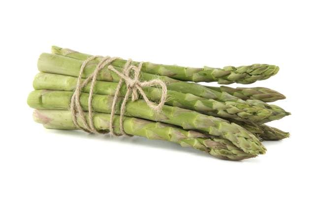 Fresh bunch of green asparagus tied with jute cord Fresh bunch of green asparagus tied with jute cord isolated on white background. Spring vegetable, eco friendly packaging Copyright: xZoonar.com NerijusxLiobex 18740327