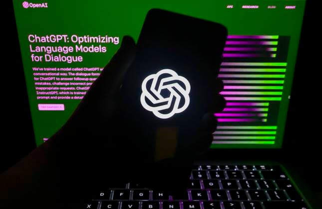 OpenAI And ChatGPT Photo Illustrations ChatGPT and OpenAI emblem is displayed on a mobile phone screen with ChatGPT website in a background for illustration photo. Gliwice, Poland on February 21st, 2023. Gliwice Poland  Copyright: xBeataxZawrzelx originalFilename: zawrzel-openaiph230221_npYy7.jpg