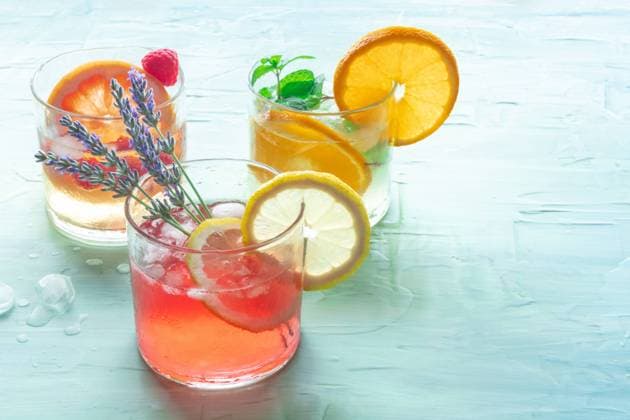 Summer cocktails or mocktails, cold drinks with citrus fruits and lavender Summer cocktails or mocktails, cold drinks with citrus fruits and lavender, party lemonade, on a blue background with a place for text Copyright: xZoonar.com KaterinaxSolovyevax 18844176