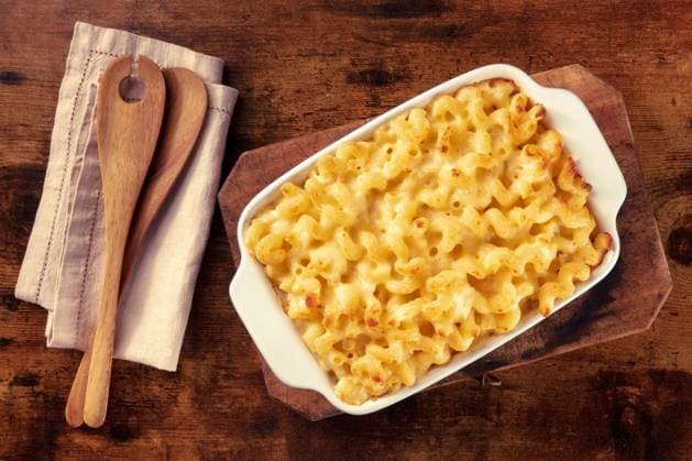 Macaroni and cheese pasta in a casserole, shot from the top Macaroni and cheese pasta in a casserole, shot from the top on a rustic background with wooden spoons Copyright: xZoonar.com KaterinaxSolovyevax 19255748