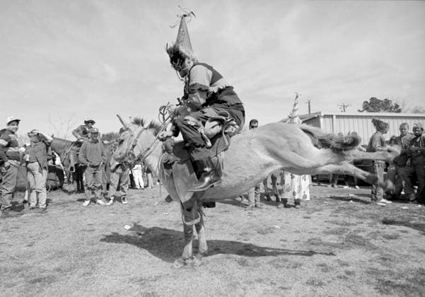 February 23, 1993, Mamou, LA, USA: MAMOU, LA - FEBRUARY 23, 1993 - Courir de Mardi Gras, or Ã¢â‚¬oeFat Tuesday Run,Ã¢â‚¬Â is part of the southern Louisiana Cajun culture. Riders on horseback ride in a group through the countryside, gathering ingredients for the townÃ¢â‚¬â ¢s communal gumbo dinner. Accompanied by a live Cajun band, riders entertain the landowners, dancing on their saddles and performing general buffoonery, hoping for a live chicken. The run starts at 7am with a caravan following, finishing in a big parade late Tuesday afternoon in downtown Mamou. Mamou USA - ZUMAsc5_ 1024533177st Copyright: xErichxSchlegelx