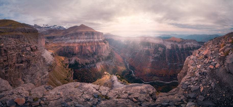 Picturesque view of rocky mountains with uneven slopes under cloudy sky with sunshine in Ordesa y Monte Perdido JavierMartinez_ID12785_387880_042 Copyright: xJavierxMartinezx Model Released