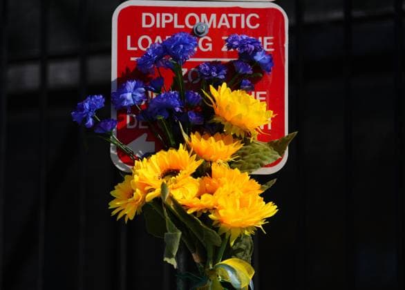 February 24, 2023, Ottawa, Ontario, Canada: Flowers are seen on a diplomatic loading zone sign as people demonstrate against the war in the Ukraine in front of the Russian embassy in Ottawa on Friday, Feb. 24, 2023. Ottawa Canada  - ZUMAc35_ 20230224_zaf_c35_018 Copyright: xSeanxKilpatrickx