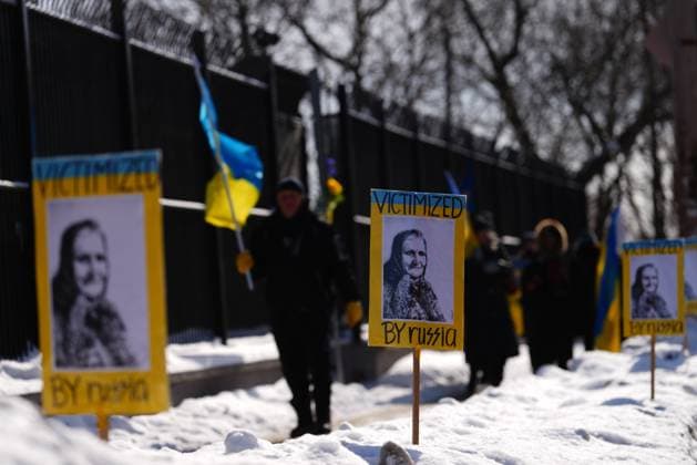 February 24, 2023, Ottawa, Ontario, Canada: People demonstrate against the war in the Ukraine in front of the Russian embassy in Ottawa on Friday, Feb. 24, 2023. Ottawa Canada  - ZUMAc35_ 20230224_zaf_c35_024 Copyright: xSeanxKilpatrickx