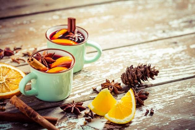 Mulled wine in rustic mugs with spices and citrus fruit on wooden background Mulled wine in rustic mugs with spices and citrus fruit on wooden background Copyright: xZoonar.com IngridxBalabanovax 19449709