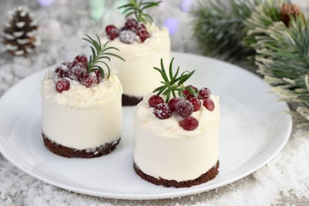 Dessert Christmas Omelia Mousse cakes with coconut cream and Greek yogurt over chocolate cake are the perfect dessert. Add whipped cream and berries. Treat friends and loved ones on Christmas or New Year s Eve Copyright: xZoonar.com MarynaxVoronovax 19486579