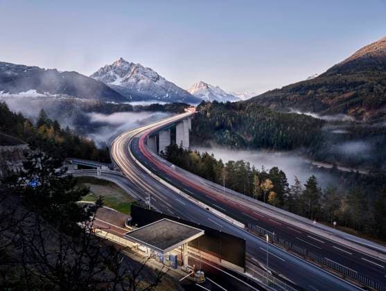 Austria, Tyrol, Vehicle light trails along Europa Bridge at dusk, CVF02293