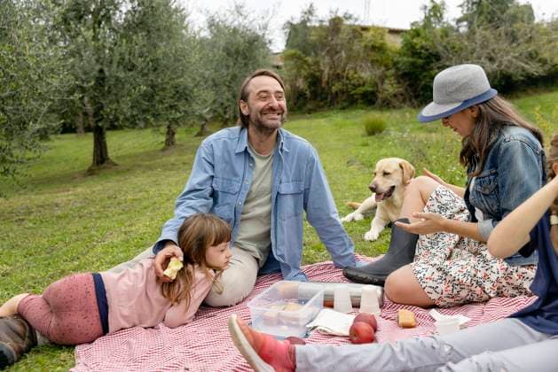 Happy family together having picnic on field model released, Symbolfoto property released, EIF04210