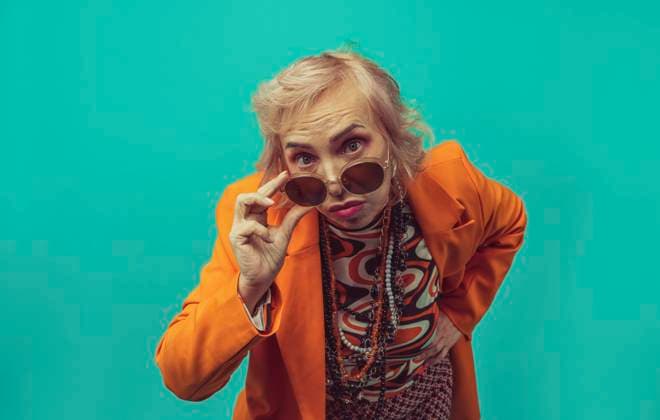Senior woman wearing sunglasses against colored background model released, Symbolfoto, OIPF02984