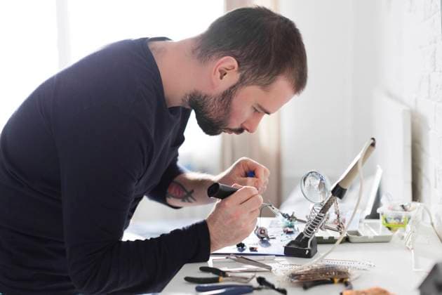 Focused engineer working with hand tools at workshop model released, Symbolfoto property released, ONAF00414