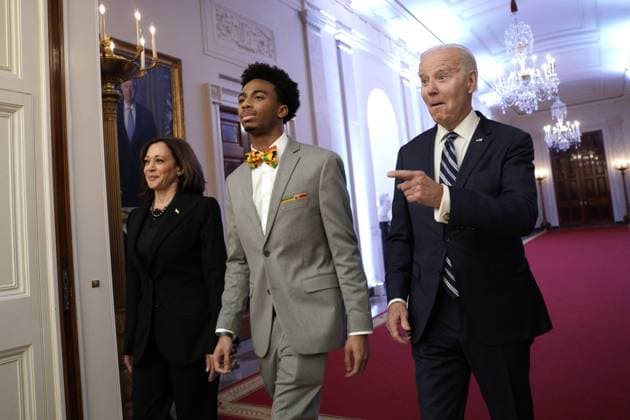 U.S. President Joe Biden gestures as he arrives with Vice President Kamala Harris and DuWayne Portis Jr., a high school student from Chicago, at a reception celebrating Black History Month at the White House in Washington, DC on Monday, February 27, 2023.  WAX20230227750 YurixGripas