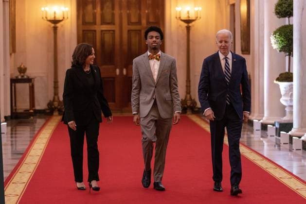 Vice President Kamala Harris, DuWayne Portis Jr. and President Joe Biden walk deliver remarkss at reception celebrating Black History month in the East Room of the White House in Washington, D.C. on Monday, February 27, 2023.  WAP2023027001 TASOSxKATOPODIS