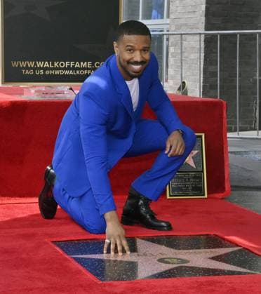 Bilder des Jahres 2023, Entertainment 03 März Entertainment Themen der Woche KW09 Entertainment Bilder des Tages Actor Michael B. Jordan touches his star after receiving the 2,751st star on the Hollywood Walk of Fame during an unveiling ceremony in Los Angeles on Wednesday, March 1, 2023.  LAP2023030101 JIMxRUYMEN