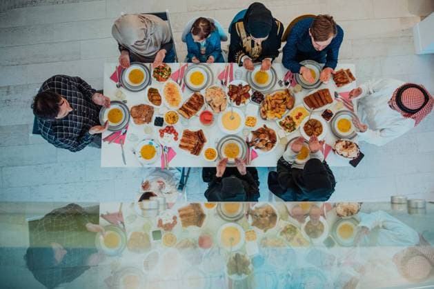 Top view of Muslim family having Iftar dinner drinking water to break feast. Eating traditional food during Ramadan feasting month at home. The Islamic Halal Eating and Drinking in modern home Top view of Muslim family having Iftar dinner drinking water to break feast. Eating traditional food during Ramadan feasting month at home. The Islamic Halal Eating and Drinking in modern home. Copyright: xZoonar.com benisxarapovicx 19707850 ,model released, Symbolfoto ,property released
